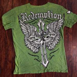 Raw State Premium Graphic Short Sleeve Henley T-Shirt with Wings and Cross Print